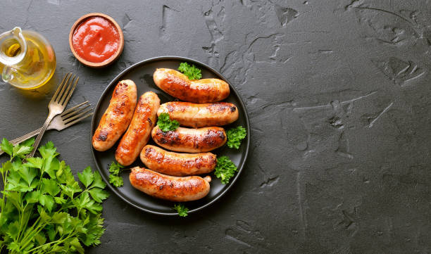 istock Barbecue sausage with fresh parsley on plate 1187144971