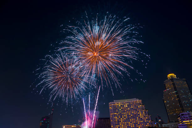 istock Beautiful firework display for celebration happy new year and merry christmas with Twilight night and firework lighting in bangkok cityscape background, Bangkok, Thailand. 1187145686