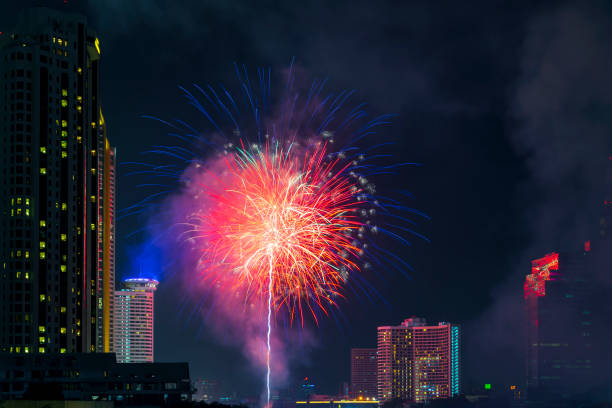istock Beautiful firework display for celebration happy new year and merry christmas with Twilight night and firework lighting in bangkok cityscape background, Bangkok, Thailand. 1187145696