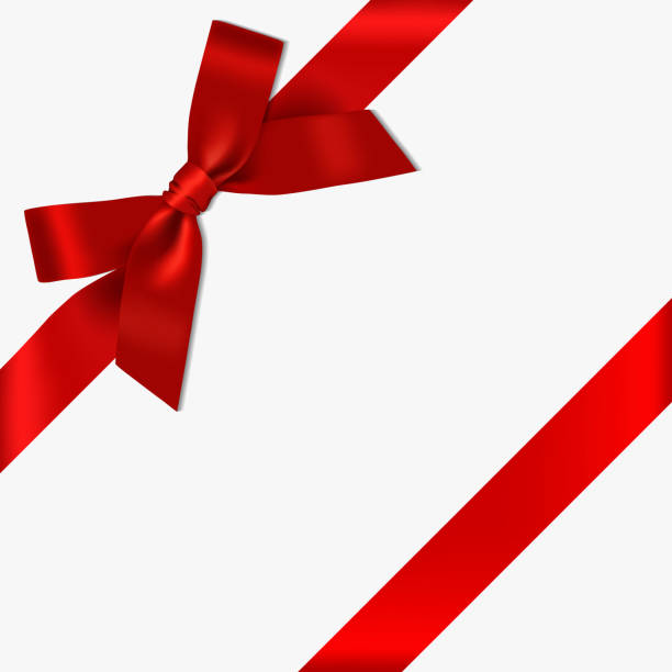 istock Realistic decorative shiny satin red ribbon bow and ribbon, isolated on white background 1187146601