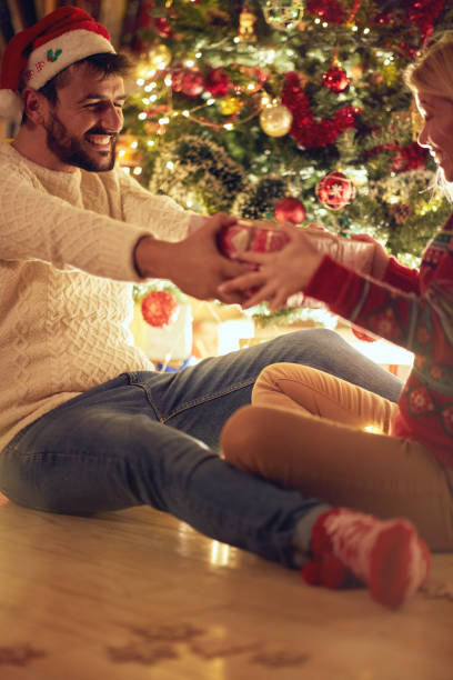 istock romantic happy couple celebrating Christmas and having fun 1187147288