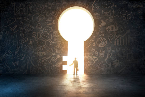istock Businessmen front of key hole door 1187148291