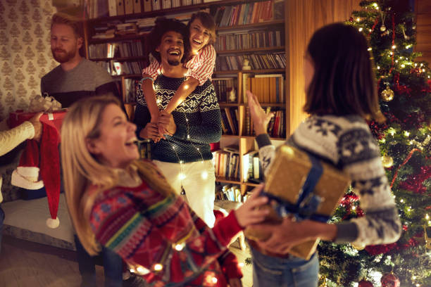 istock happy multiethnic friends celebrating Christmas together 1187149056