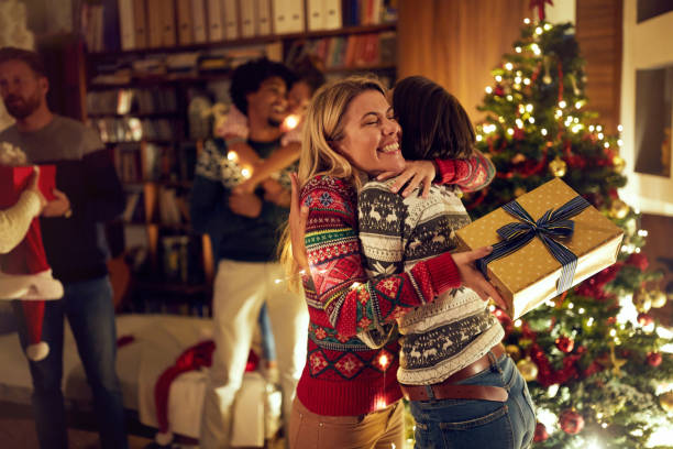 istock happy girlfriends celebrating Christmas together 1187149294