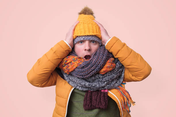 istock Handsome caucasian funny man in several hats and scarfs. 1187150414