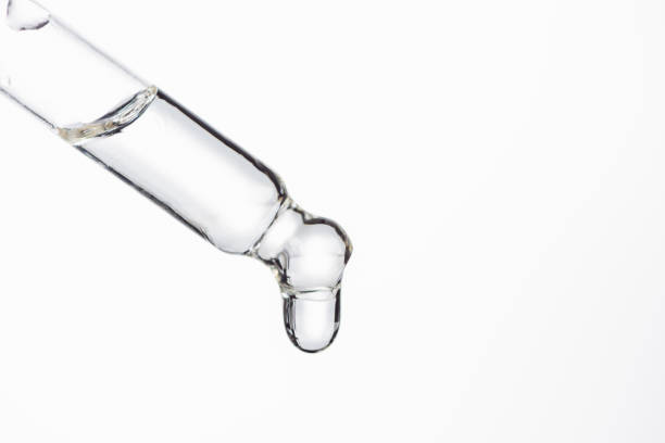 istock pipetted with natural serum with drop isolated on white 1187150923