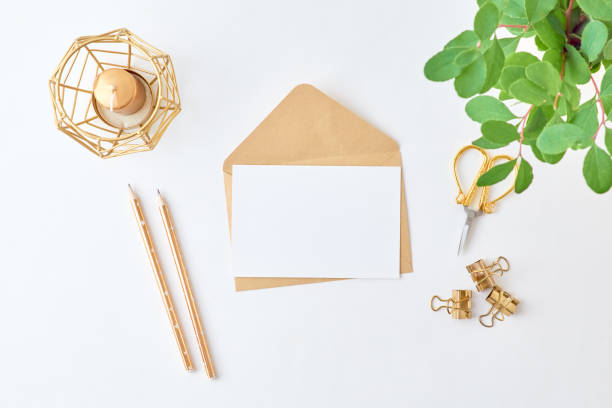 istock Mockup white greeting card and envelope with branches with green leaves on a light background 1187151781