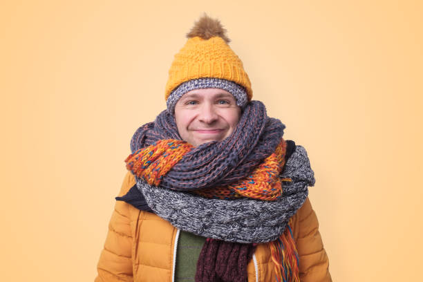 istock Handsome caucasian funny man in several hats and scarfs. 1187151955