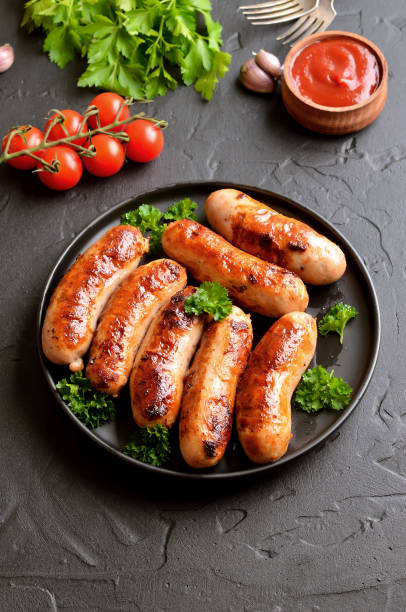 istock Fried sausage with fresh parsley on plate 1187152070