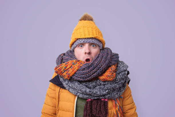 istock Handsome caucasian funny man in several hats and scarfs. 1187152111