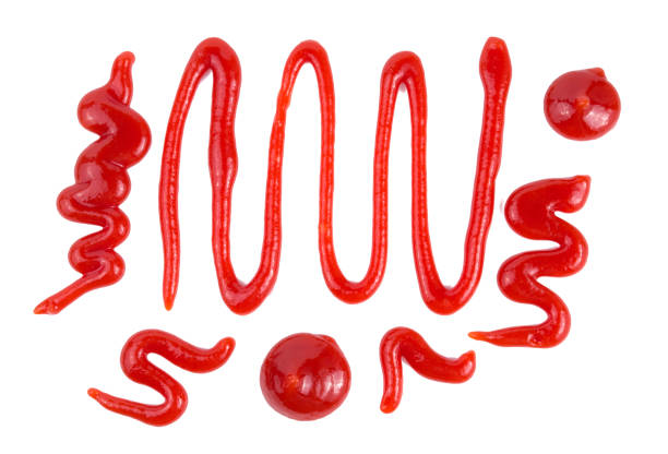 istock Red tomato ketchup splashes isolated on white background, 1187153773