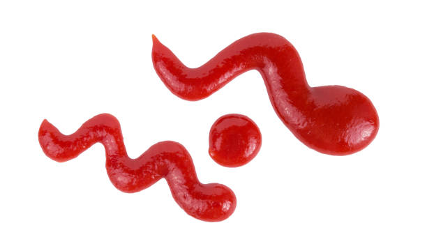 istock Red tomato ketchup splashes isolated on white background, 1187153774