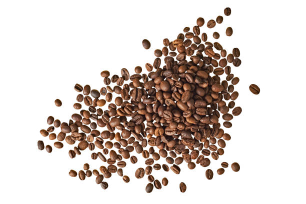 istock Many scattered roasted coffee beans isolated on white background without shadow. Close-up. Top view 1187156612