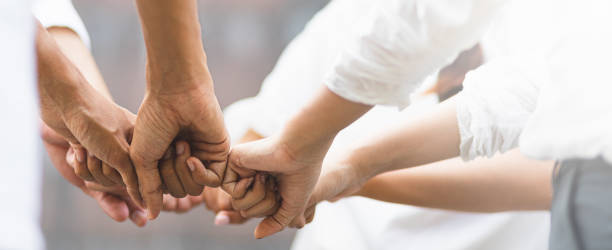istock Panoramic teamwork business join hand together concept, Business team standing hands together, Volunteer charity work. People joining for cooperation success business. 1187156918