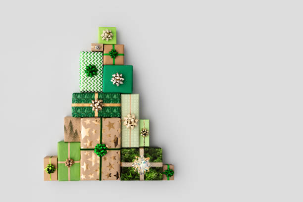 Christmas tree made from Christmas gifts Christmas gift boxes laid out in the shape of a Christmas tree, overhead view christmas gift stock pictures, royalty-free photos & images