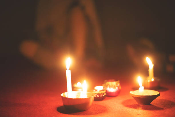Many candlelights on the floor in dim light