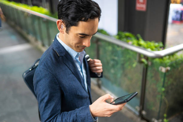 istock Typing an e-mail on his way to the office 1187160444