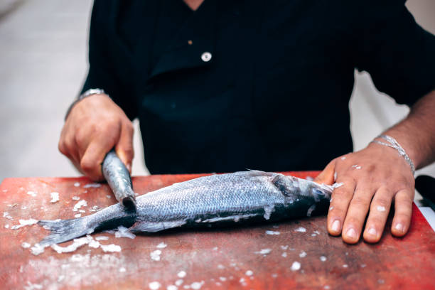 istock Chef preparing fish or seafood meal. 1187160685