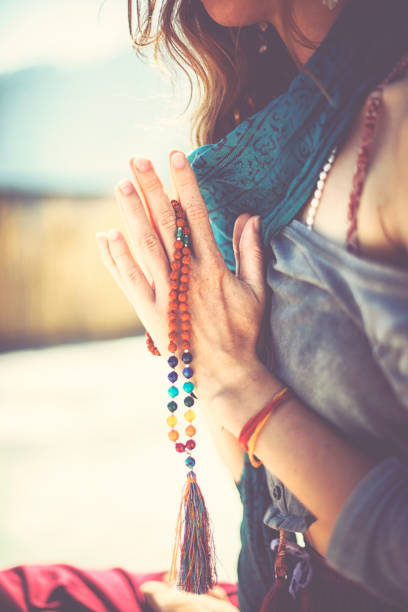 young woman practicing yoga and meditation in sunshine of india - spiritual practices imagens e fotografias de stock