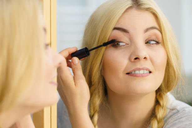 istock Woman using mascara on her eyelashes 1187161409