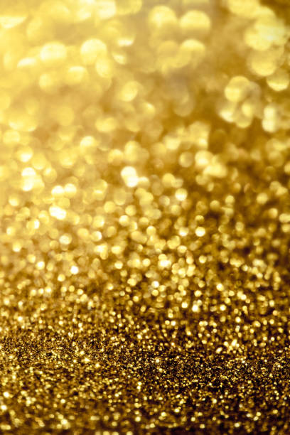 istock golden glitter bokeh lighting texture Blurred abstract background for birthday, anniversary, wedding, new year eve or Christmas 1187165058