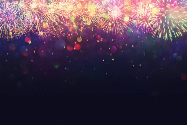 istock beautiful fireworks and glitter bokeh lighting effect Colorfull Blurred abstract background for anniversary, new year eve or Christmas 1187165246