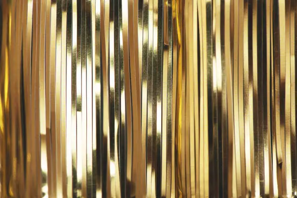 Photo of Golden foil tinsel strips.