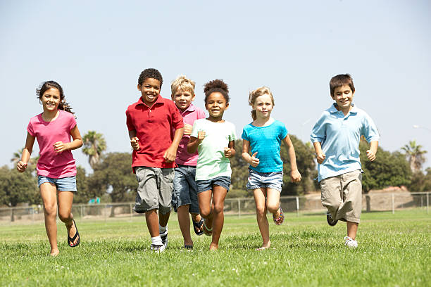 istock Group Of Children Running In Park 118716649