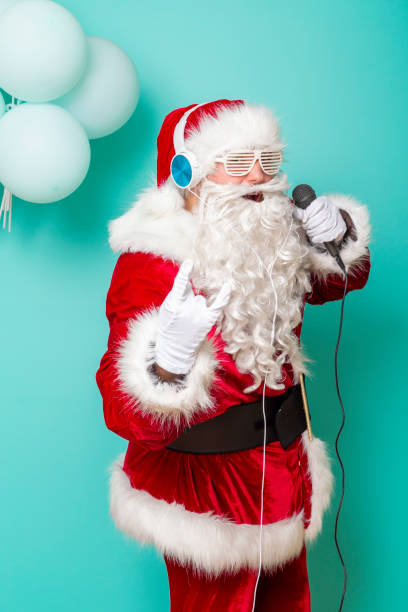 istock Santa Claus singing and dancing 1187167371