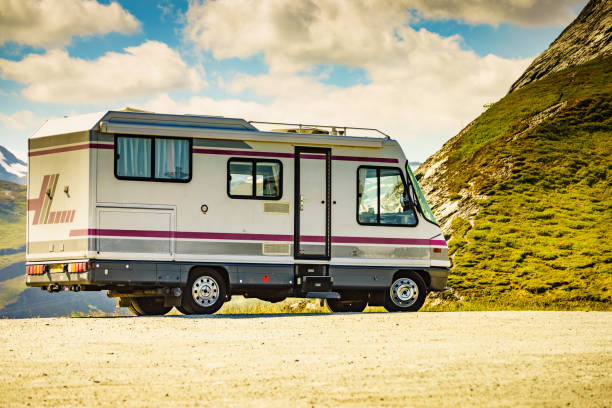 Camper car on roadside in norwegian mountains Camper car on roadside in norwegian mountains. Traveling, holidays and adventure concept. Norway Scandinavia Europe. RV truck stock pictures, royalty-free photos & images