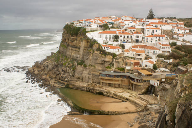 istock village sea watering 1187169575