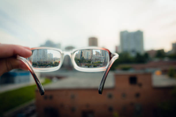 istock View through glasses sharp with glasses unsharp without glasses. City view through glasses 1187173551