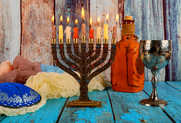istock Brightly Glowing Hanukkah Menorah soft focus 1187176634