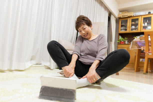istock Senior woman training at home 1187178167