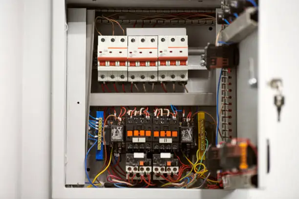 Photo of Circuit breaker in switch box. Control voltage switchboard. Distribution board for control electrical voltage in house or office.