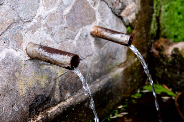 istock Source of two pipes with crystal clear water 1187182299