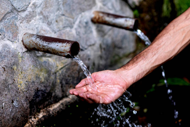 istock Source of two pipes with crystal clear water 1187182337