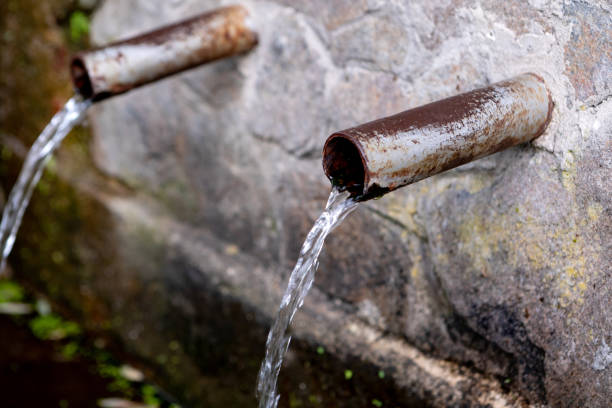 istock Source of two pipes with crystal clear water 1187182351