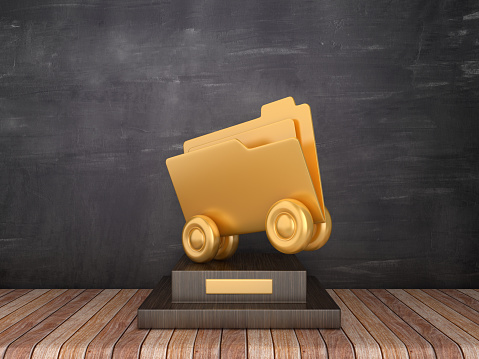 Trophy with Folder on Wheels on Wood Floor - Chalkboard Background - 3D Rendering