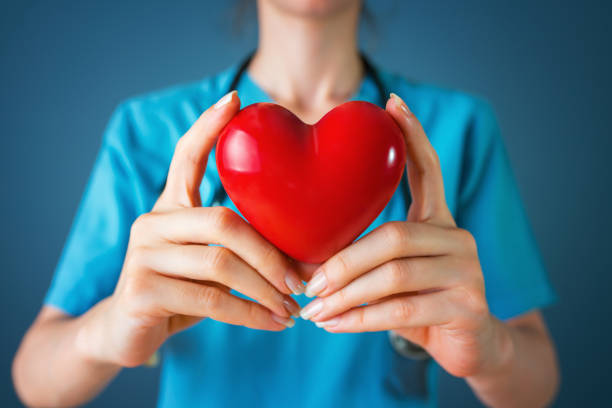 istock Doctor holding heart 1187184879