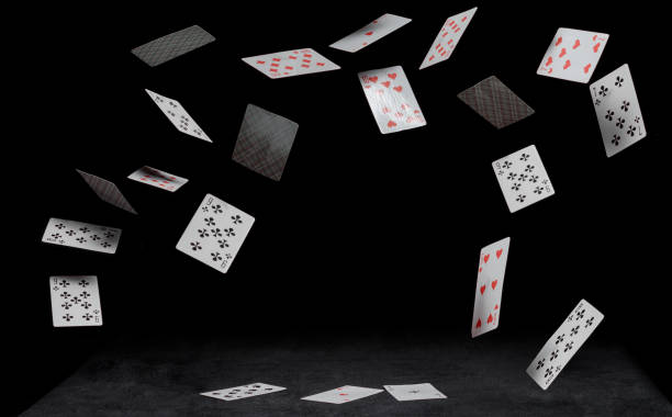 playing cards fall on a black table - poker cards royal flush heart shape imagens e fotografias de stock