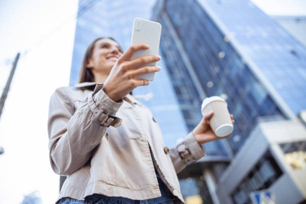 istock Happy woman walking alone in the downtown 1187187411