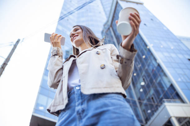 istock Pretty lady telling her friend her location 1187187427