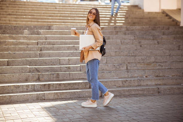 istock Cheerful girl strolling through the city centre 1187187435
