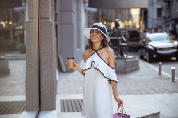istock Pretty woman going to walk into a store 1187187624