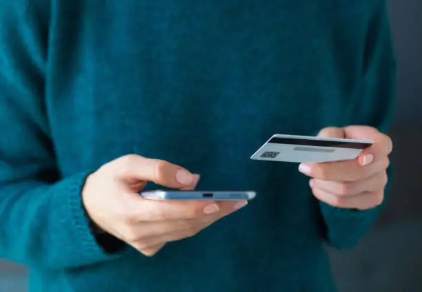 Photo of Online shopping using smartphone with credit card