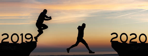 istock Businessman jump between 2019 and 2020 years 1187190648
