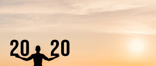 Man practicing yoga during the celebration New Year 2020