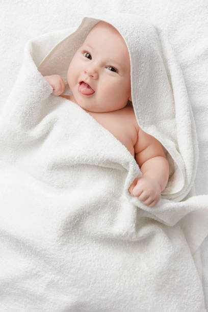 istock Smiling baby in a towel 1187192597