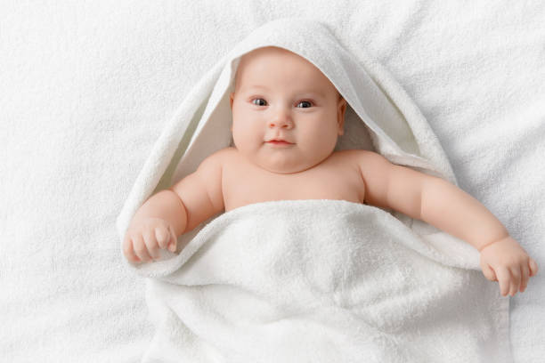 istock Smiling baby in a towel 1187193231